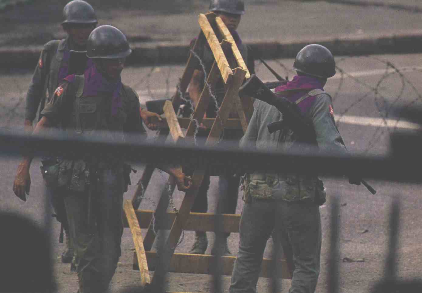 Soldiers putting up barricade 1988